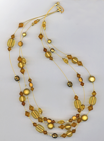 Gold triple strand necklace